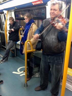 Sneaky shot of the violinist who plays the same 2 songs on the Metro - 1/31/15